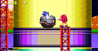 Sonic floats along underneath the very rockets of the Death Egg, only to happen across rival Knuckles one last time. He's perched atop a precarious girder and promptly punches you backwards when you collide with him.