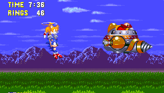 The doctor didn't count on the rather sudden stamina increase of Tails, who air lifts Sonic out of danger and together they're now in hot pursuit! You now control both - tap the up button to go up, and left and right to move around. Jump off to hit Eggman on the head, but avoid the drill and fire jets!