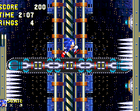 These long conveyor belt elevators are a big, regular problem in both acts thanks to their combination with other hazards. While they travel downwards, the motion of the conveyor will constantly try to force you into spikes and missiles on the walls. You can avoid missiles on one side entirely by staying close enough to the other side that they don't appear on screen. This will prevent them from firing.