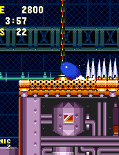 This is a tougher one for Sonic that occurs right before Point #11. Spin dash underneath this chained block as it's pulled upwards..