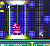 ..Knuckles has visibly taken more damage from the electric shock than he might want to let on. Fortunately, he doesn't have to walk far, as a teleporter can be found in the next room. Sonic automatically follows him into the beam, and both are delivered to the Sky Sanctuary Zone, in hot pursuit of the thief!