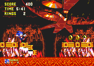 ..Eventually, you land on a platform resting on the lava. The great eyes of the Death Egg light up and create a blinding flash, igniting the whole area and turning everything a crimson red. The central platforms crumble, leaving Sonic teetering on the edge!