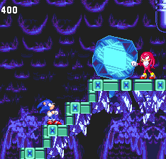 ..At the top, Knuckles is waiting for you, still under Eggman's influence. We haven't seen him in a while, but without even saying hello, he punches a massive ice boulder down the steps towards you..