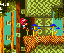 Knuckles can get through this wall easily, just to the side of a curved pit, just by touching it, but it's not accessible to Sonic.