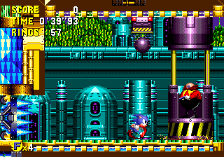 Eggman is in an inaccessible booth, as you run along a conveyor belt heading straight back towards some spikes. A large ball appears on the ceiling, tracking your movements..
